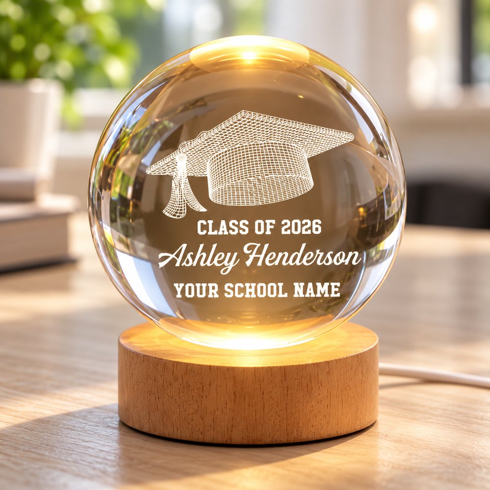 Close-up of 3D engraved graduation cap and custom text inside crystal ball night light
