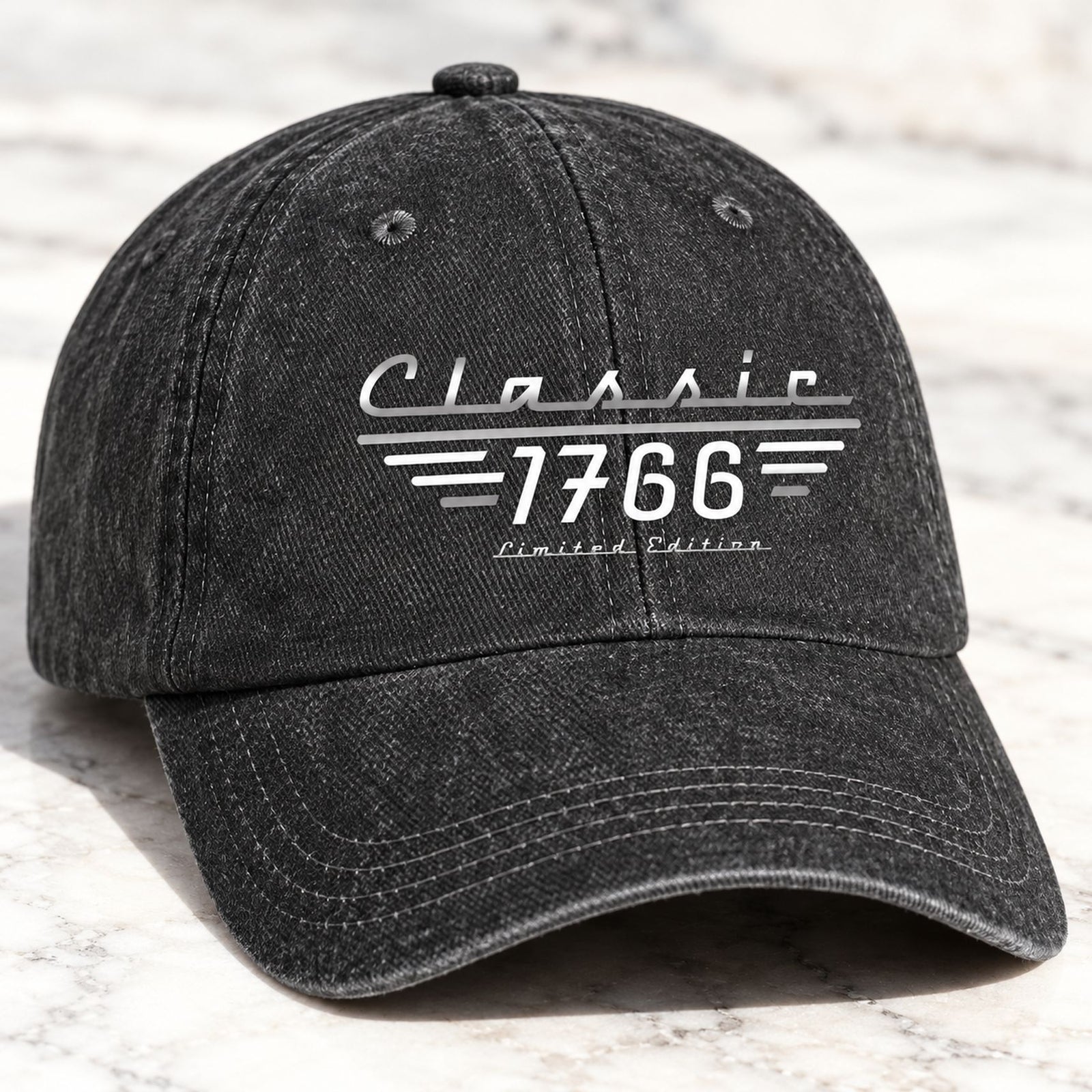 Close-up of washed denim texture and Classic 1766 print on baseball cap