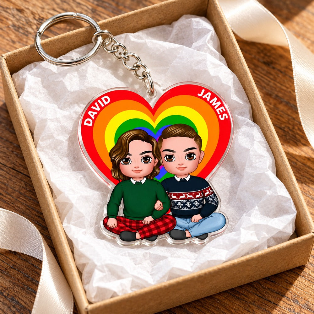 Personalized Couple Heart Pride acrylic keychain nestled in an open gift box with tissue paper