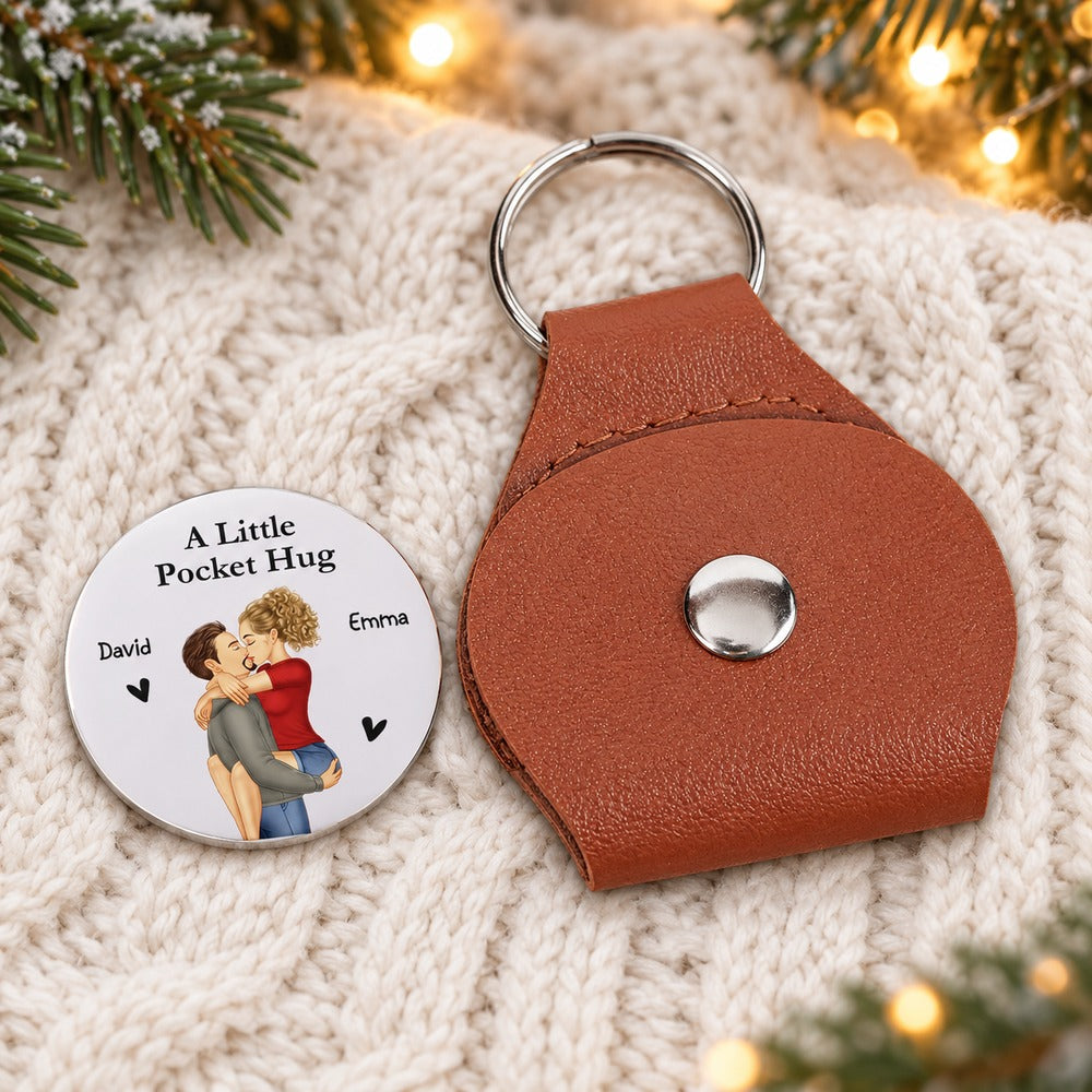 Personalized couple leather pocket hug and David Emma coin on cream knit throw with festive pine bokeh
