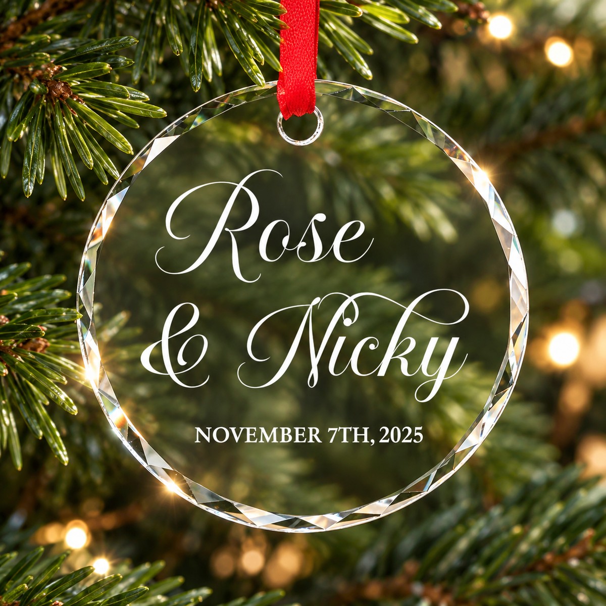 Personalized couple circle glass ornament Rose and Nicky hanging on a Christmas tree branch