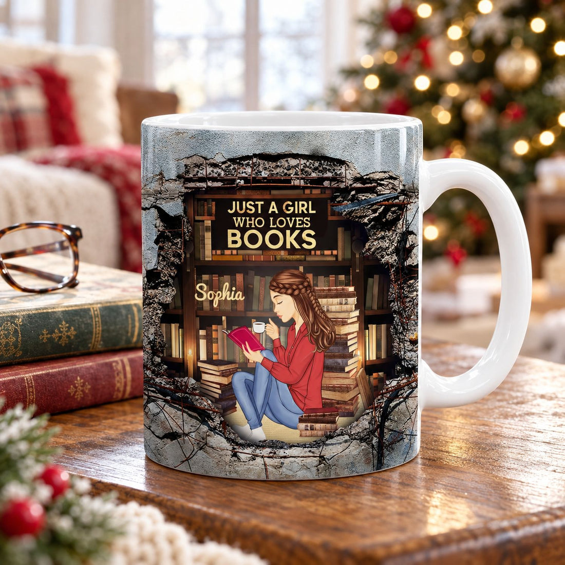 Custom book lover ceramic mug on side table with stacked books and holiday tree background