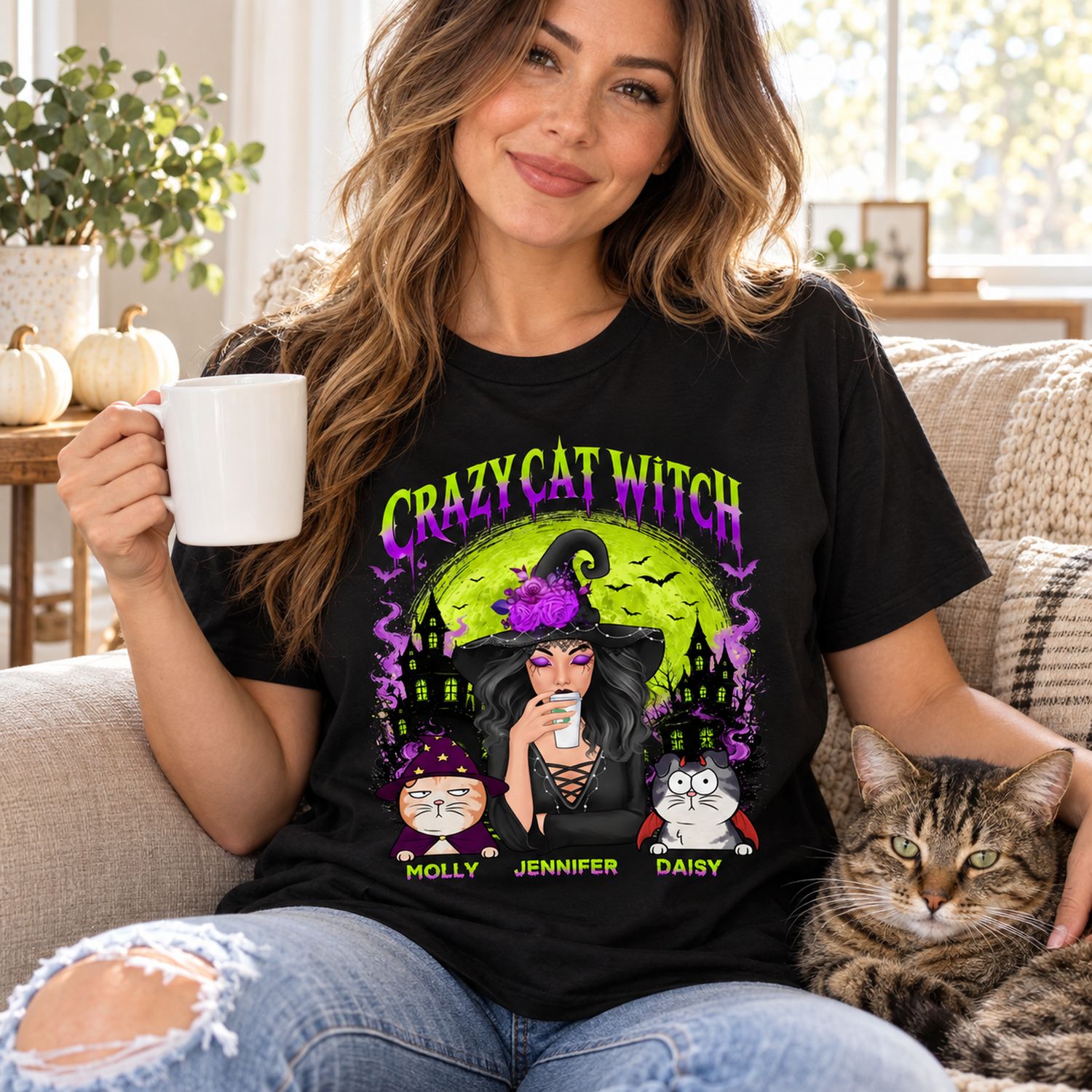 Woman wearing Crazy Cat Witch personalized Halloween t-shirt on sofa with cat