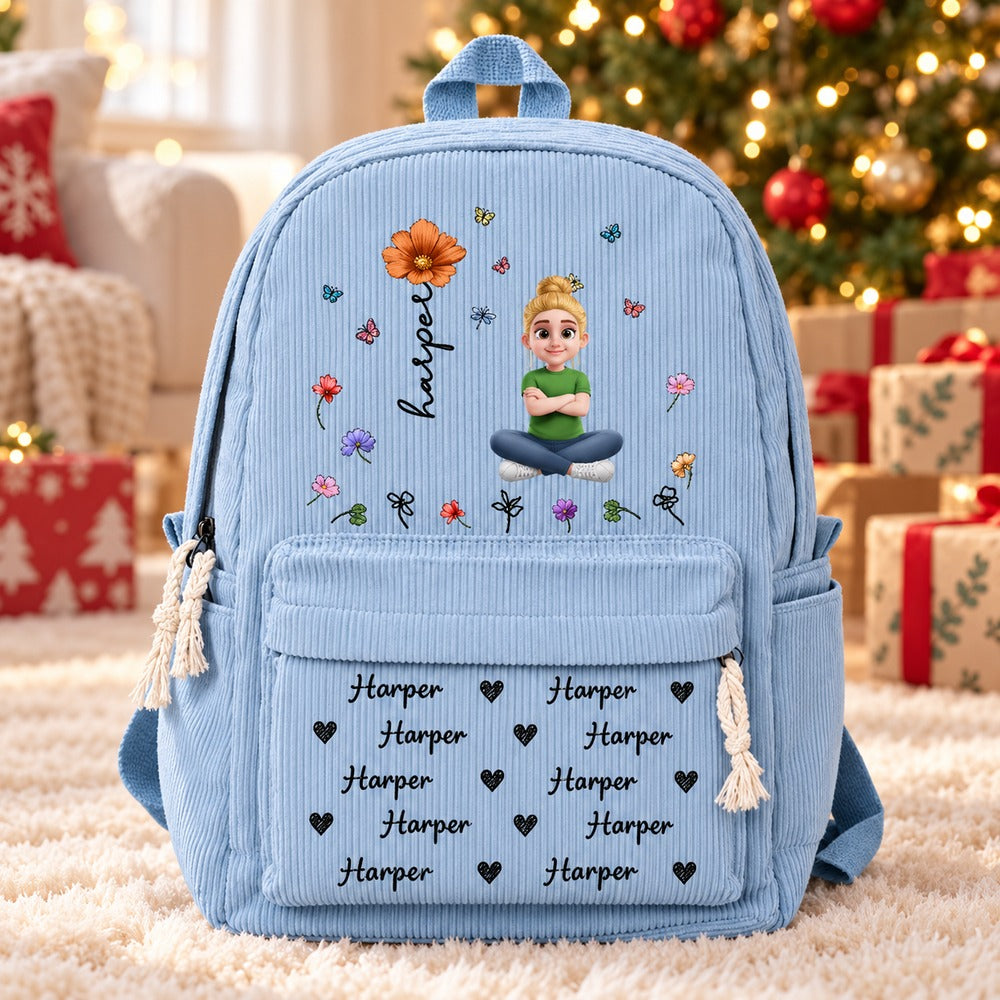 Personalized blue corduroy kids backpack with Harper birth flower print by a Christmas tree