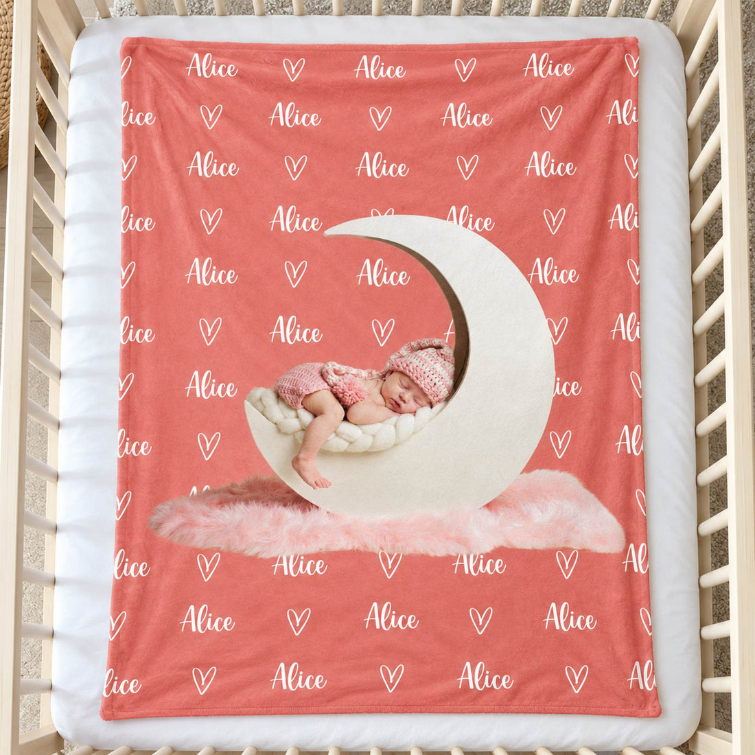 Custom photo baby blanket with name Alice spread flat on a white nursery crib mattress