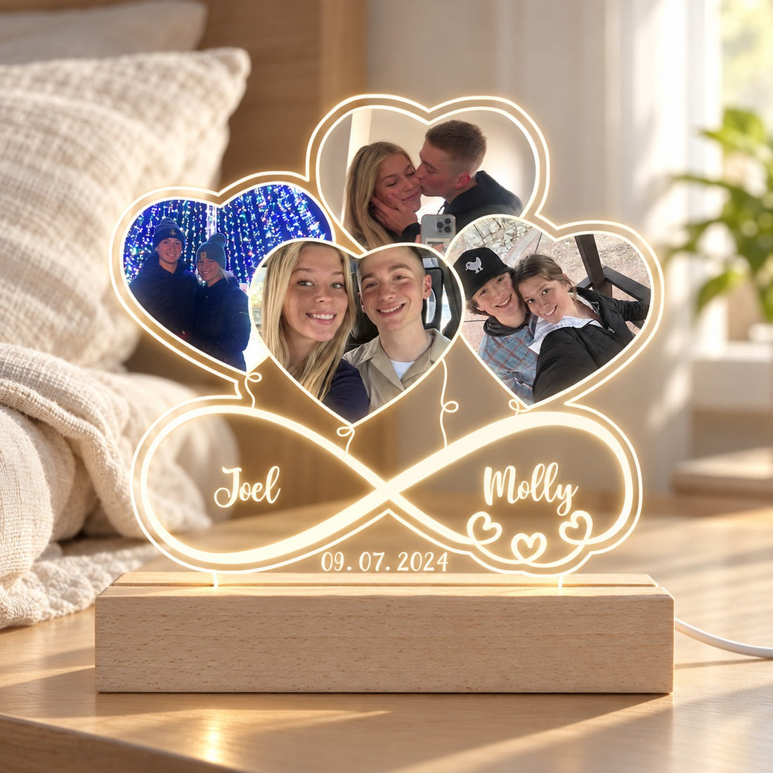 Personalized couple photo infinity LED night light glowing on bedroom nightstand