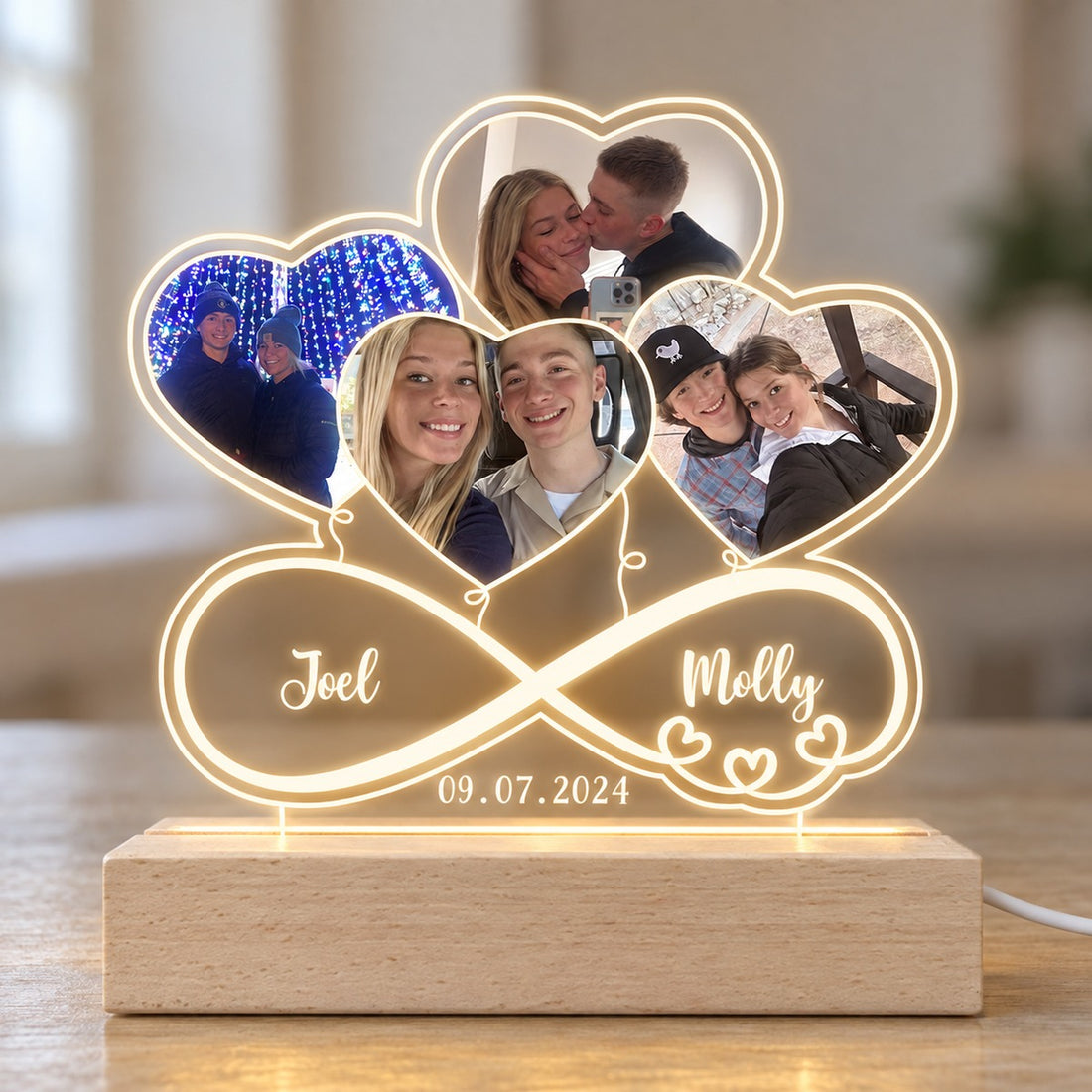 Close-up detail of personalized couple infinity heart acrylic LED plaque and wood base