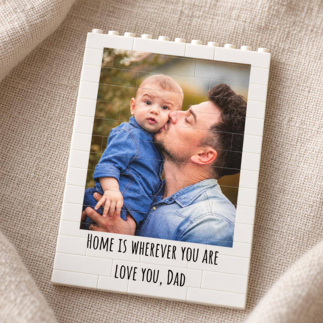 Personalized Father's Day building brick photo block lying flat on a soft linen surface