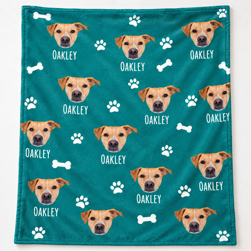 Close-up detail of plush fleece texture and custom dog face print on teal blanket