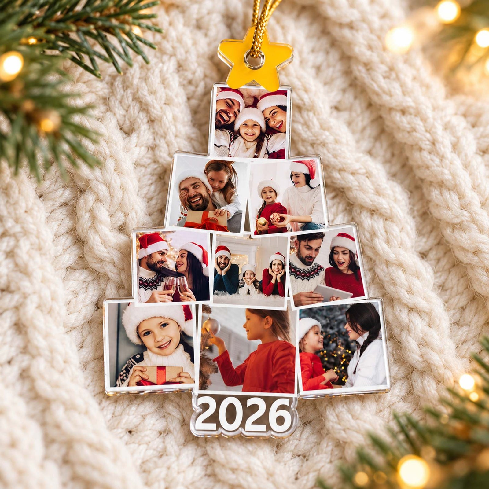 Custom photo family tree acrylic ornament 2026 lying flat on cozy cream knit with Christmas greenery
