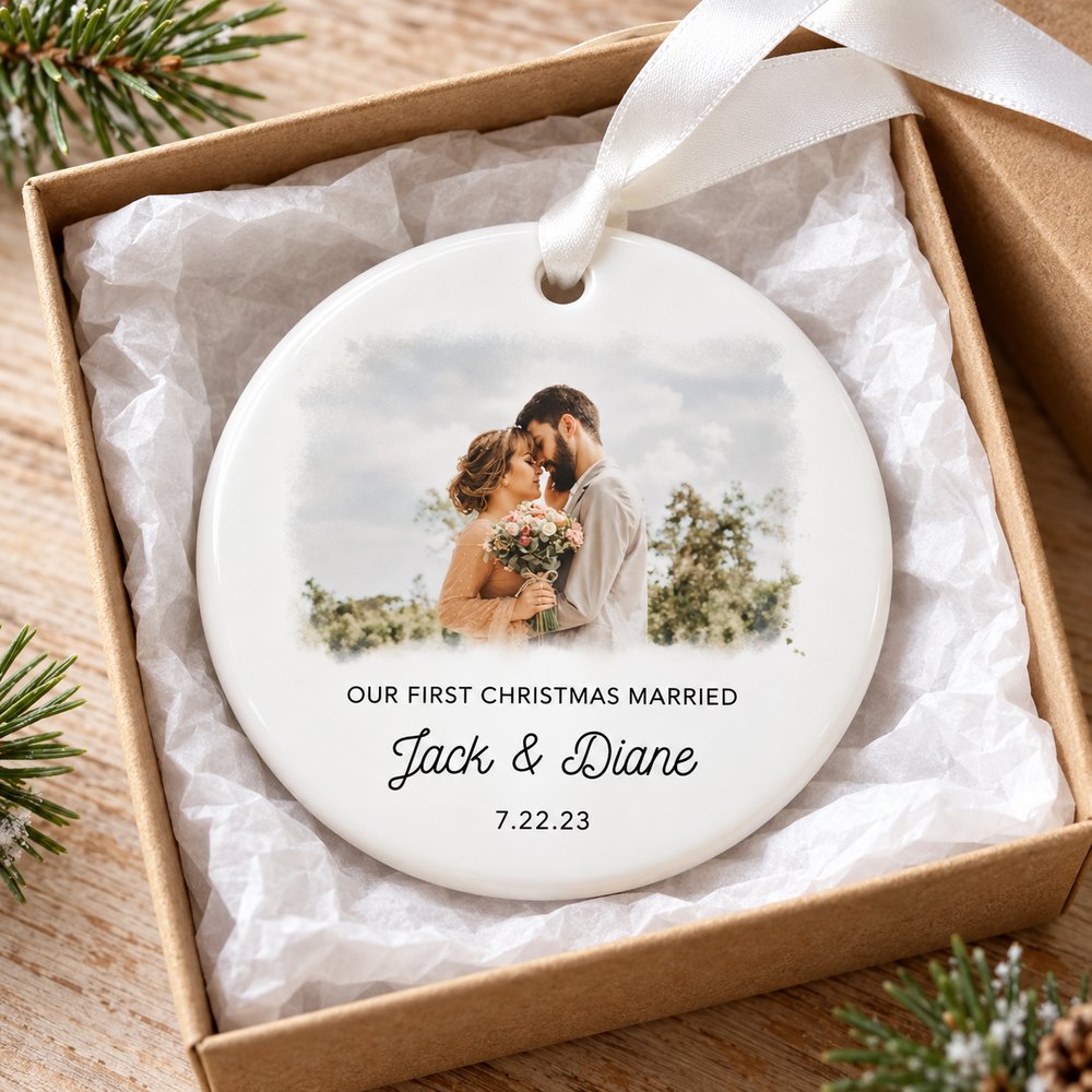 Personalized first Christmas married ceramic ornament in a holiday gift box with ribbon