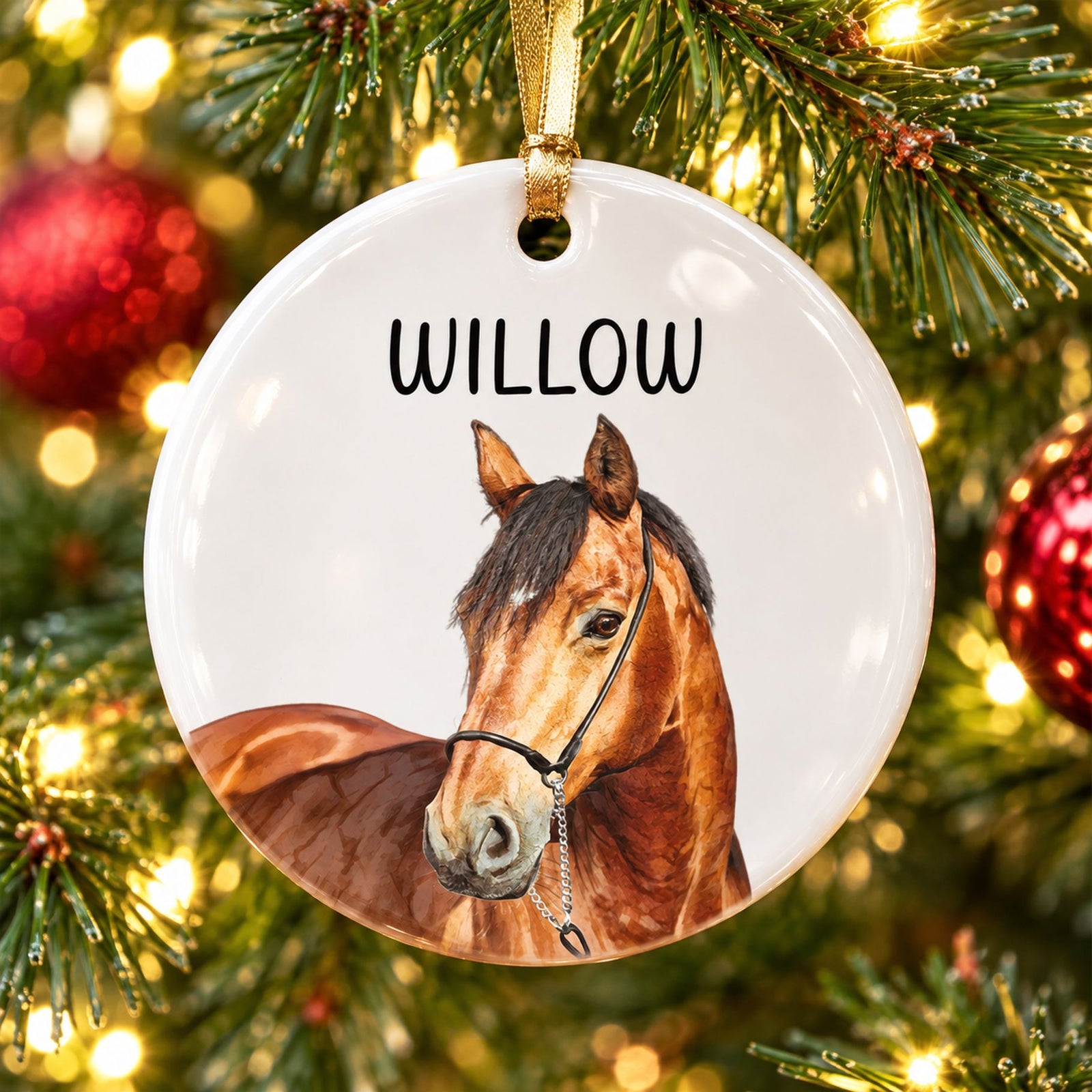 Custom photo horse ceramic ornament hanging on a Christmas tree branch with warm lights