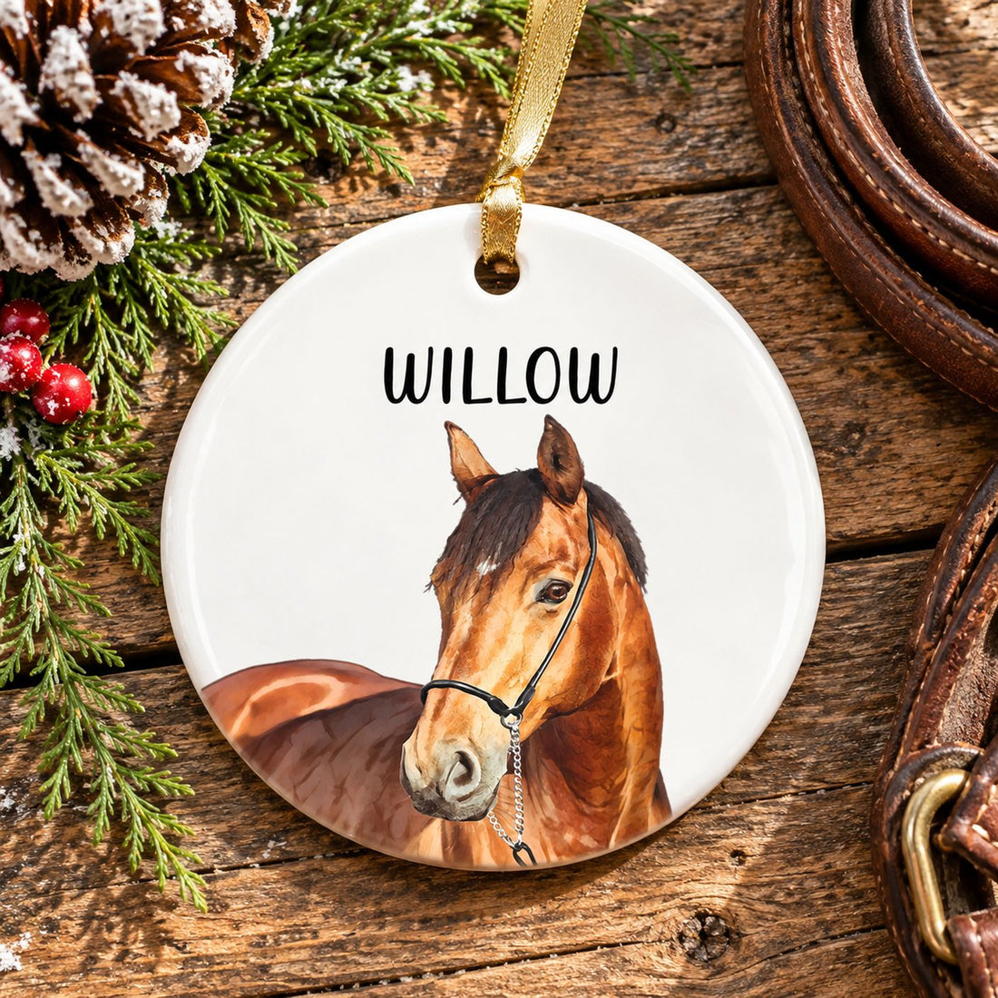 Personalized ceramic horse ornament on a wooden holiday table with pine sprigs