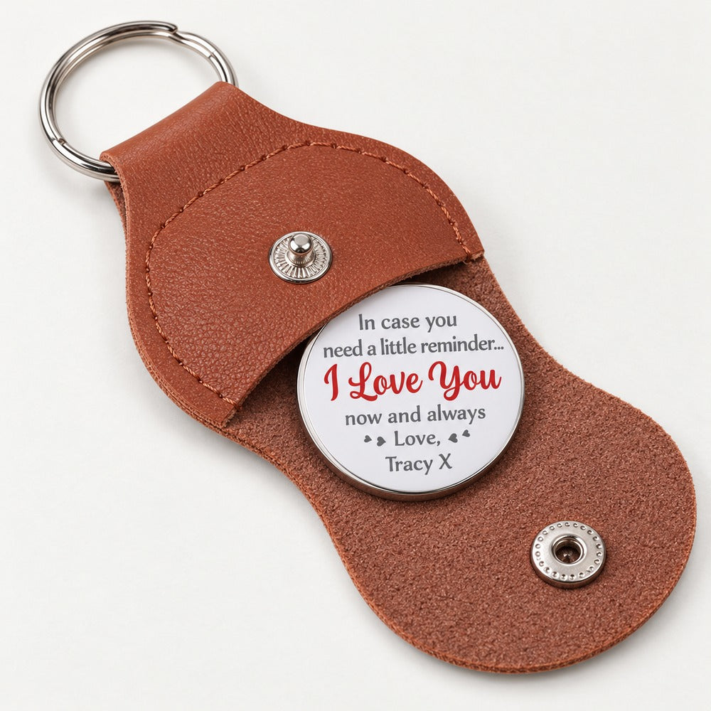 Macro closeup of personalized pocket hug coin text and brown pebbled leather stitching