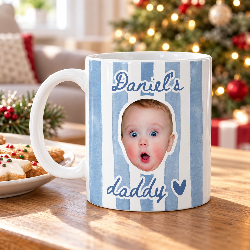 Custom baby face photo mug for daddy on a holiday table near a Christmas tree