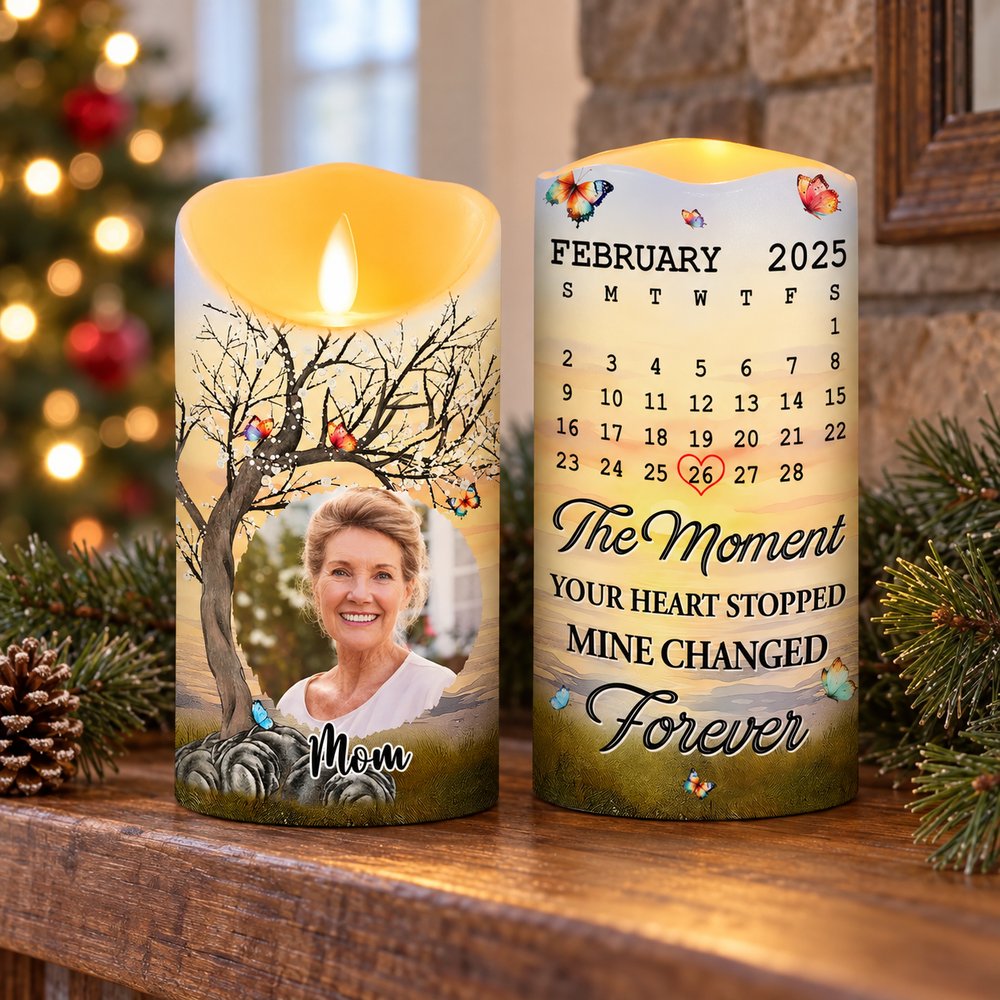 Custom photo memorial LED candle glowing on a holiday mantel with pine sprigs