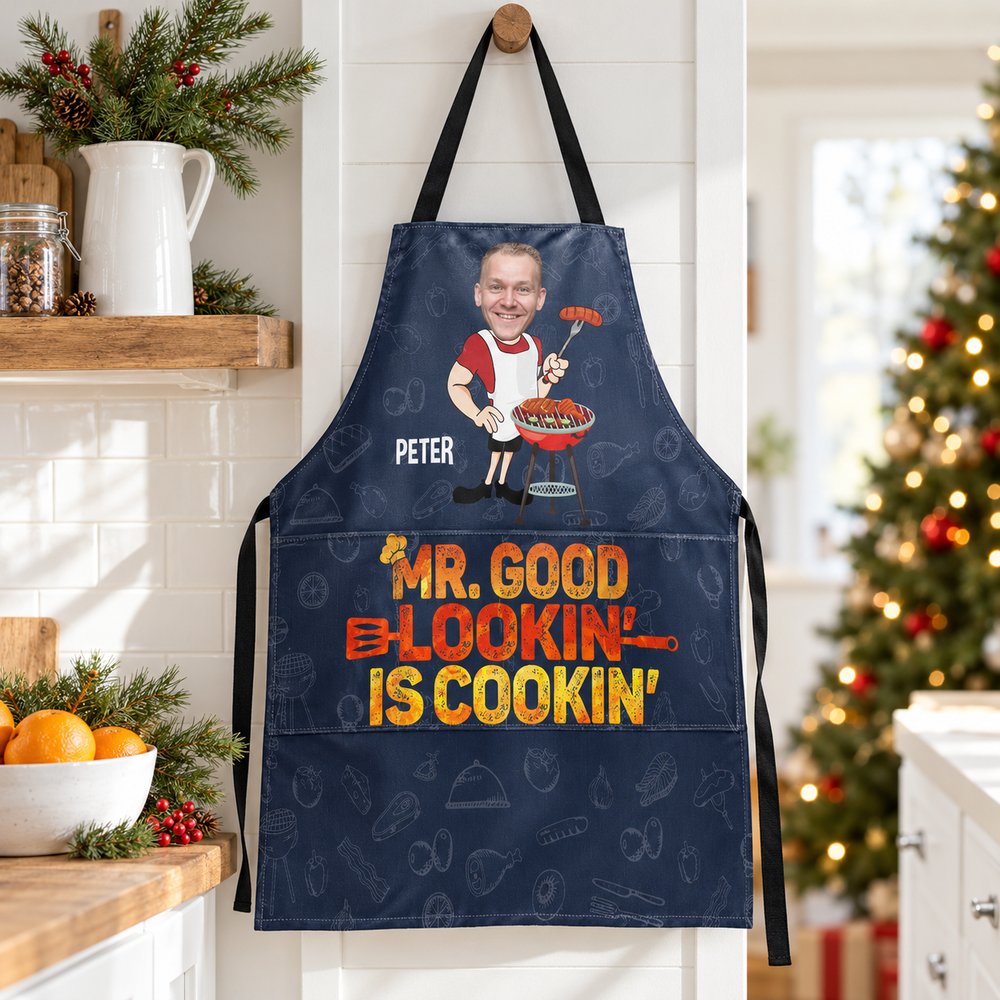 Personalized Mr Good Lookin Is Cookin apron hanging in a festive holiday kitchen