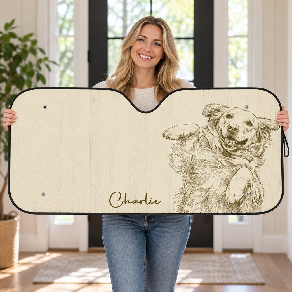Happy dog owner holding their custom pencil sketch dog portrait car sunshade