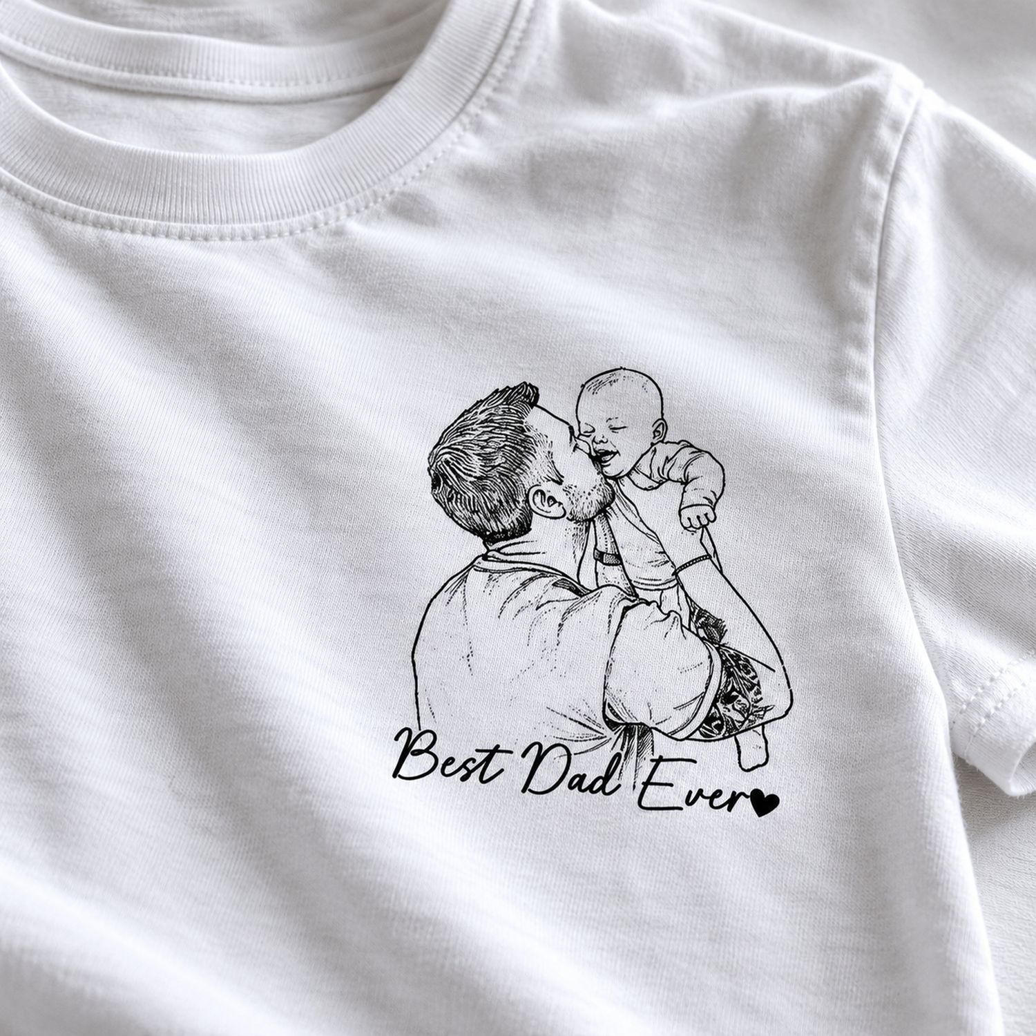 Close-up of black line art father and baby sketch print and Best Dad Ever text on white cotton t-shirt