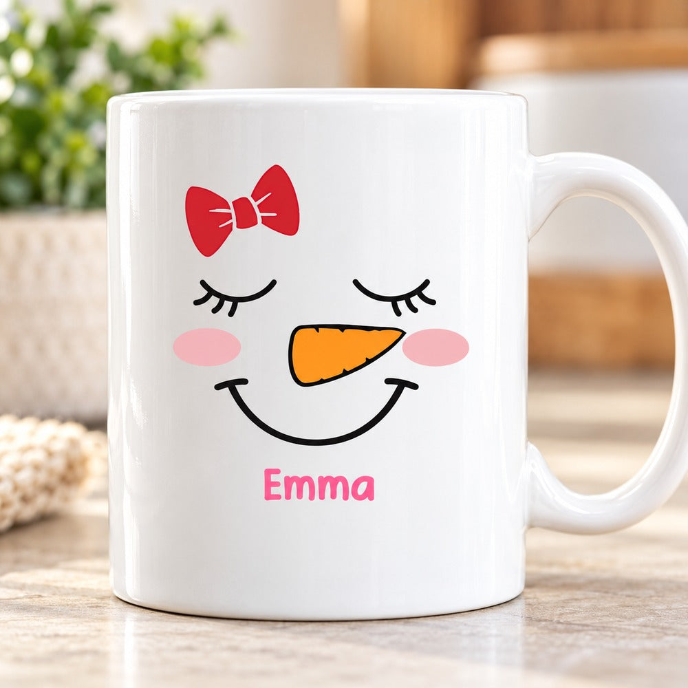 Close up detail of glossy ceramic mug print with cute snowgirl face and Emma name