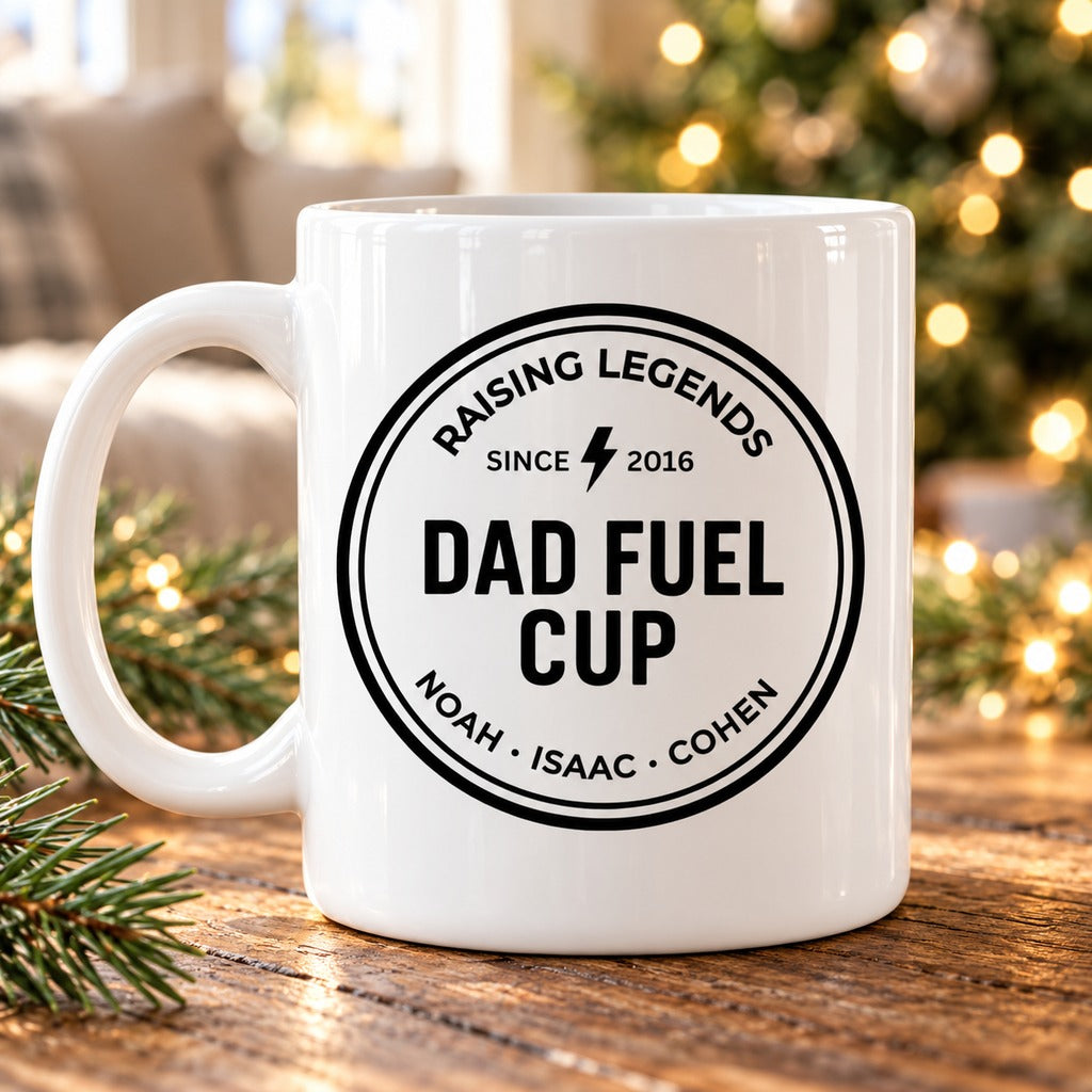 Personalized Dad Fuel Mug with kids names on a holiday table near Christmas lights
