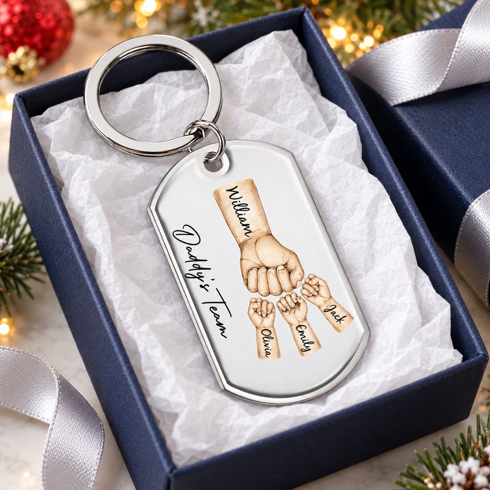 Personalized Daddy's Team fist bump stainless steel keychain in an open gift box for holiday gifting
