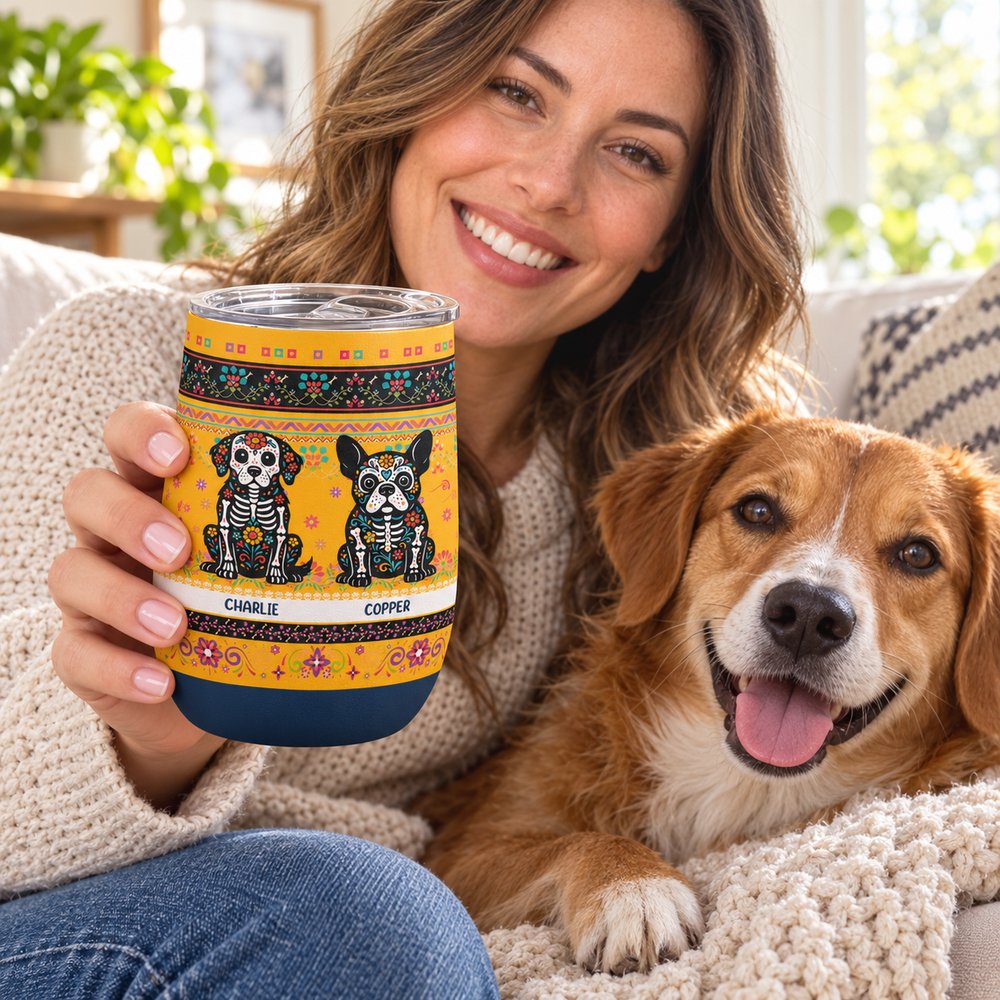 Woman holding custom sugar skull dog 12oz wine tumbler on sofa with dog