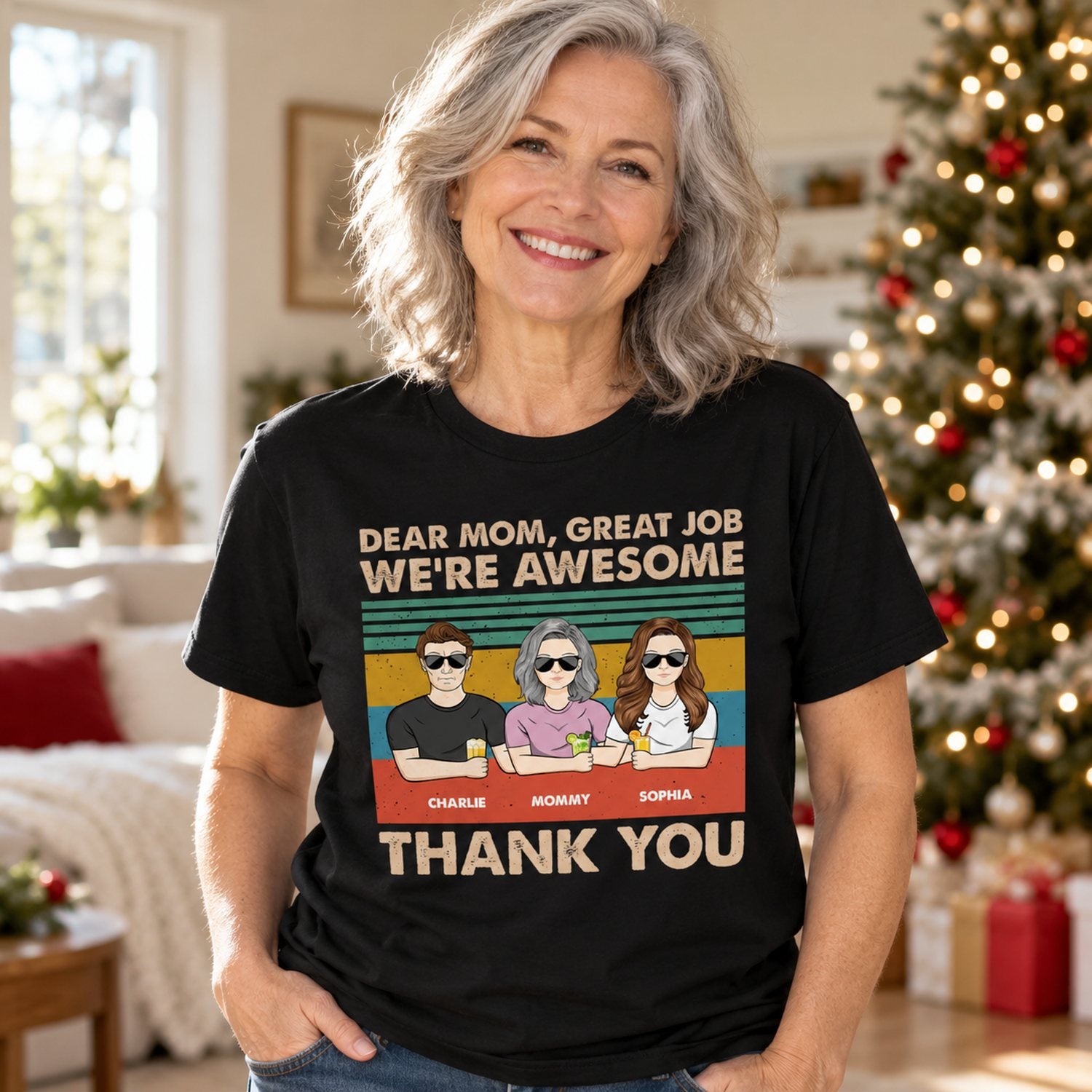 Grey-haired mom wearing personalized Dear Mom Great Job We Are Awesome black t-shirt in holiday room