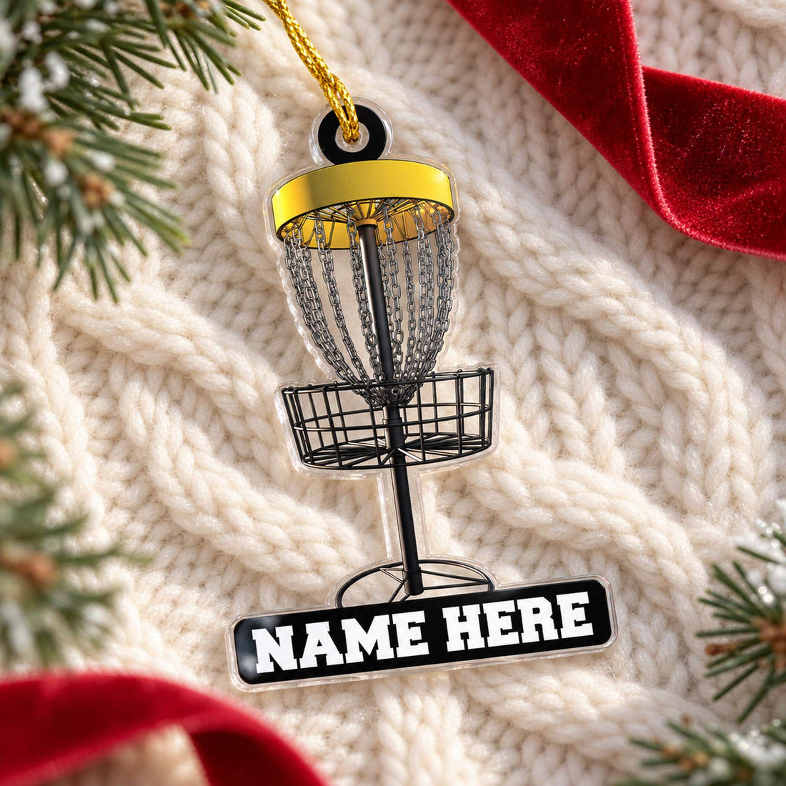 Custom shaped disc golf Christmas ornament lying flat on cozy holiday knit fabric with greenery