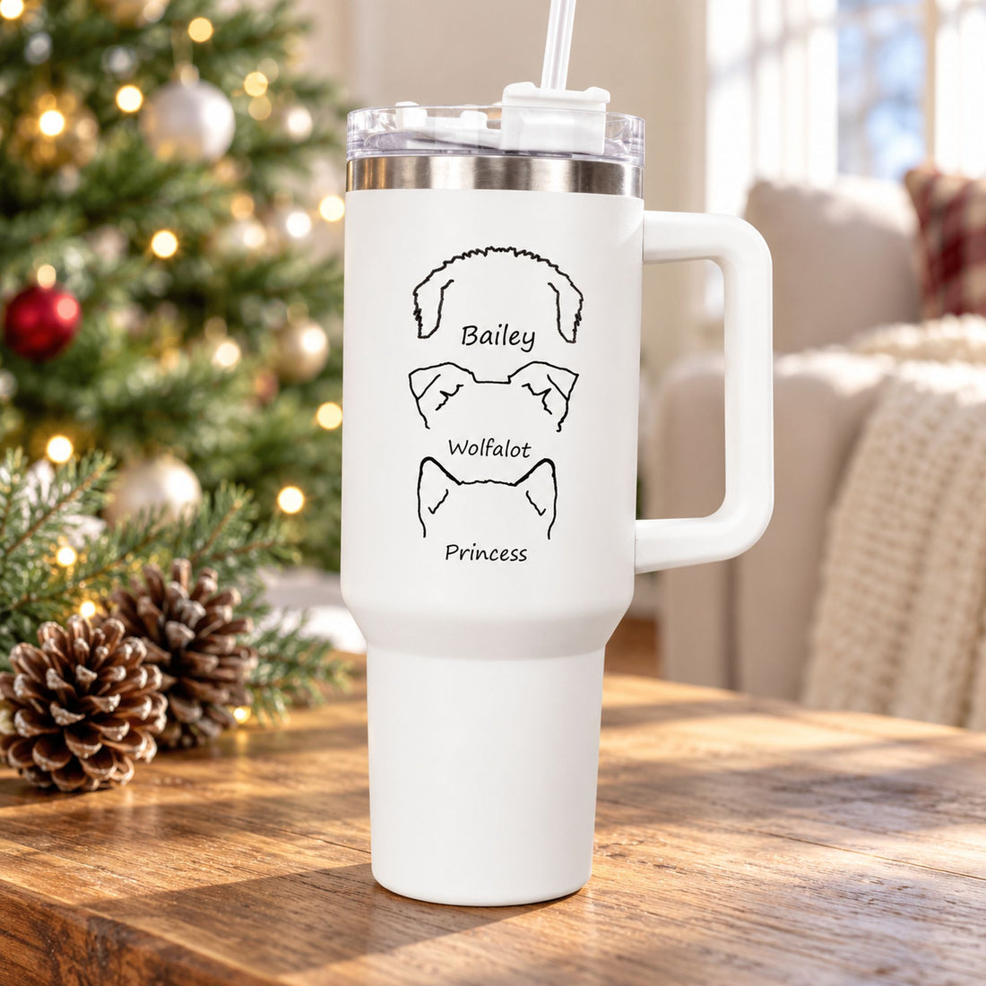 Personalized 40oz white dog lover tumbler on a holiday coffee table near a Christmas tree