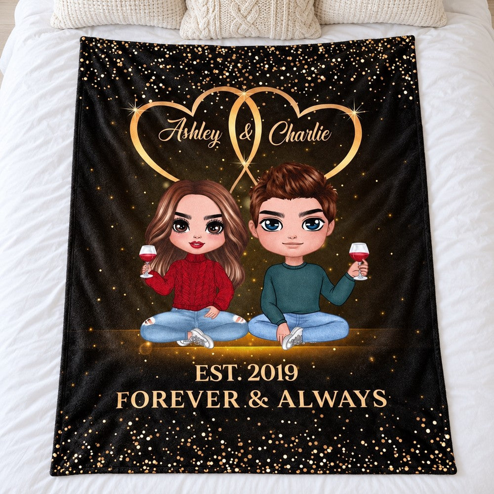 Personalized doll couple blanket spread flat on a white bed showing full Ashley and Charlie design