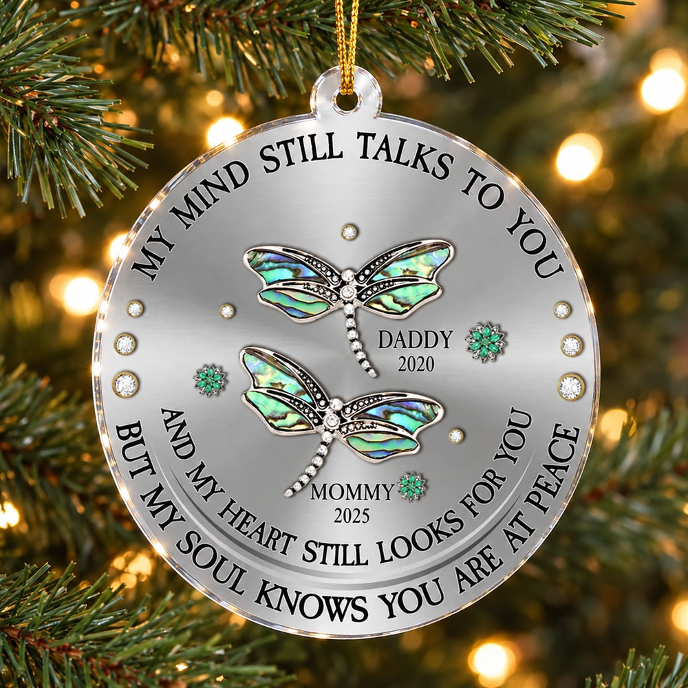 Dragonfly memorial acrylic ornament hanging on a Christmas tree branch with warm lights