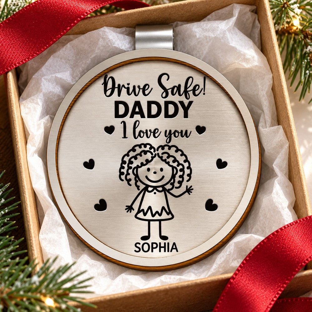 Personalized Drive Safe Daddy car visor clip in a Christmas gift box with ribbon and pine sprigs