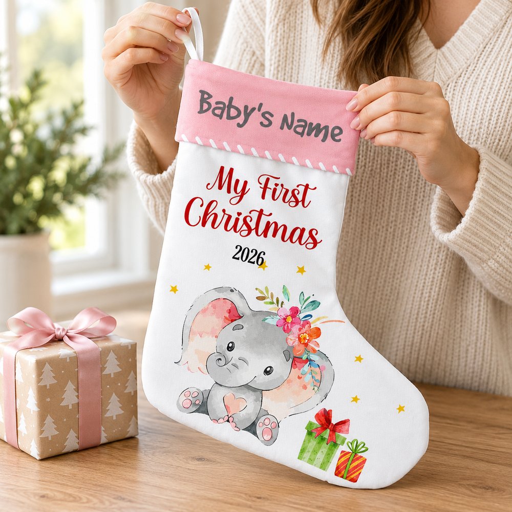 Hands holding the 7.5x16.5 inch personalized elephant baby Christmas stocking to show size