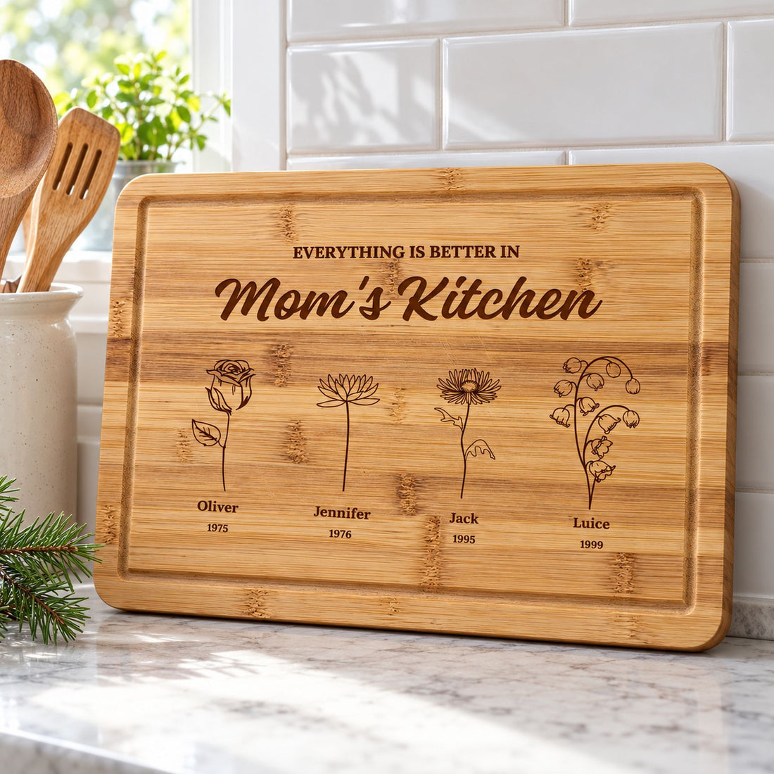 Personalized Mom's Kitchen engraved wooden cutting board displayed on a bright kitchen counter