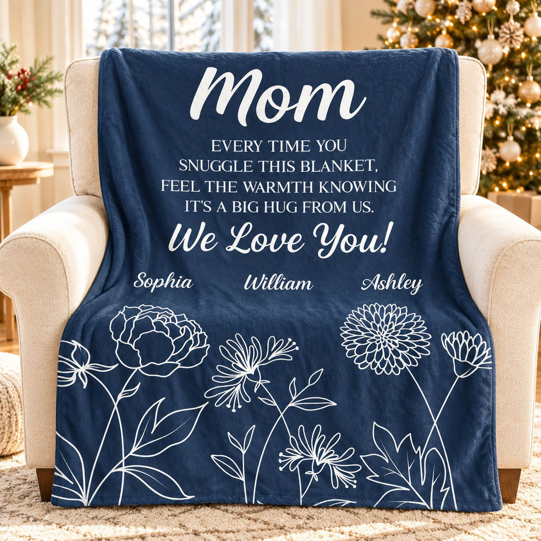 Personalized Mom fleece blanket with birth flowers draped on armchair in cozy holiday living room