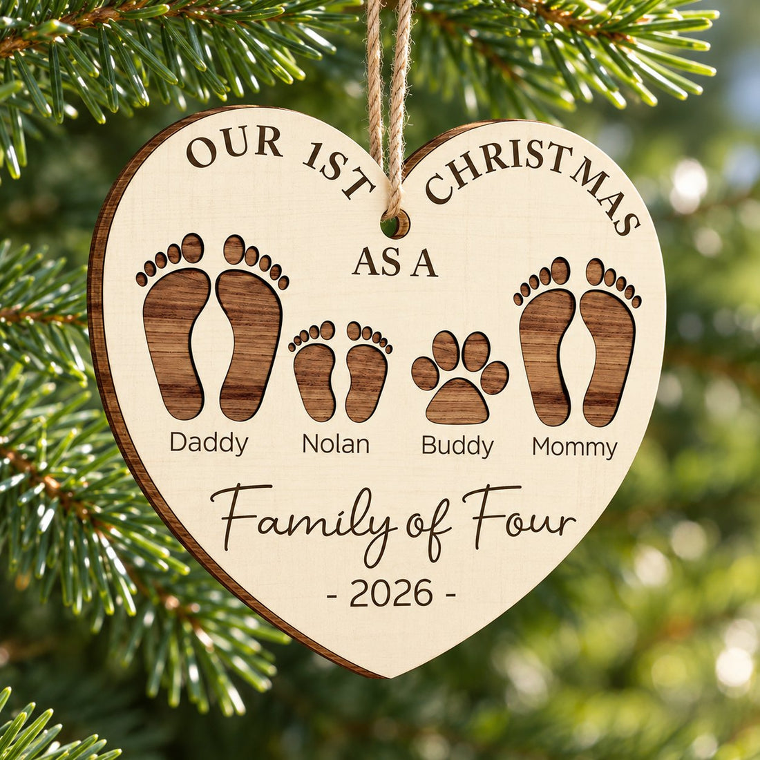 Close-up of personalized Family of Four wood ornament showing layered laser-cut footprints and wood grain
