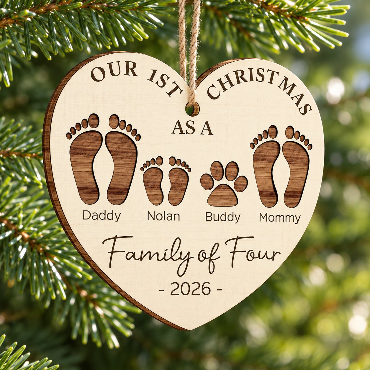 Close-up of personalized Family of Four wood ornament showing layered laser-cut footprints and wood grain