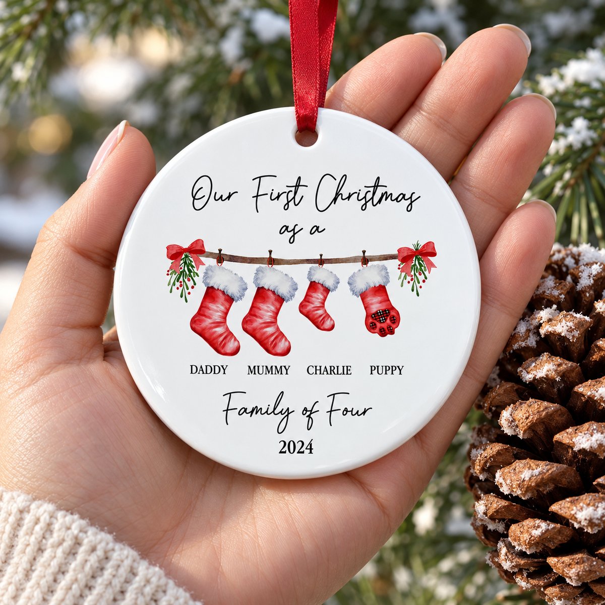3x3 inch round ceramic family ornament held in a hand to show real size