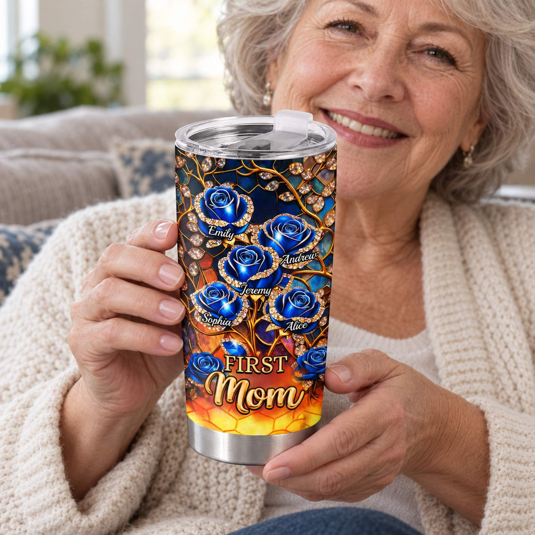 Grandmother holding personalized blue rose 20oz tumbler on cozy sofa