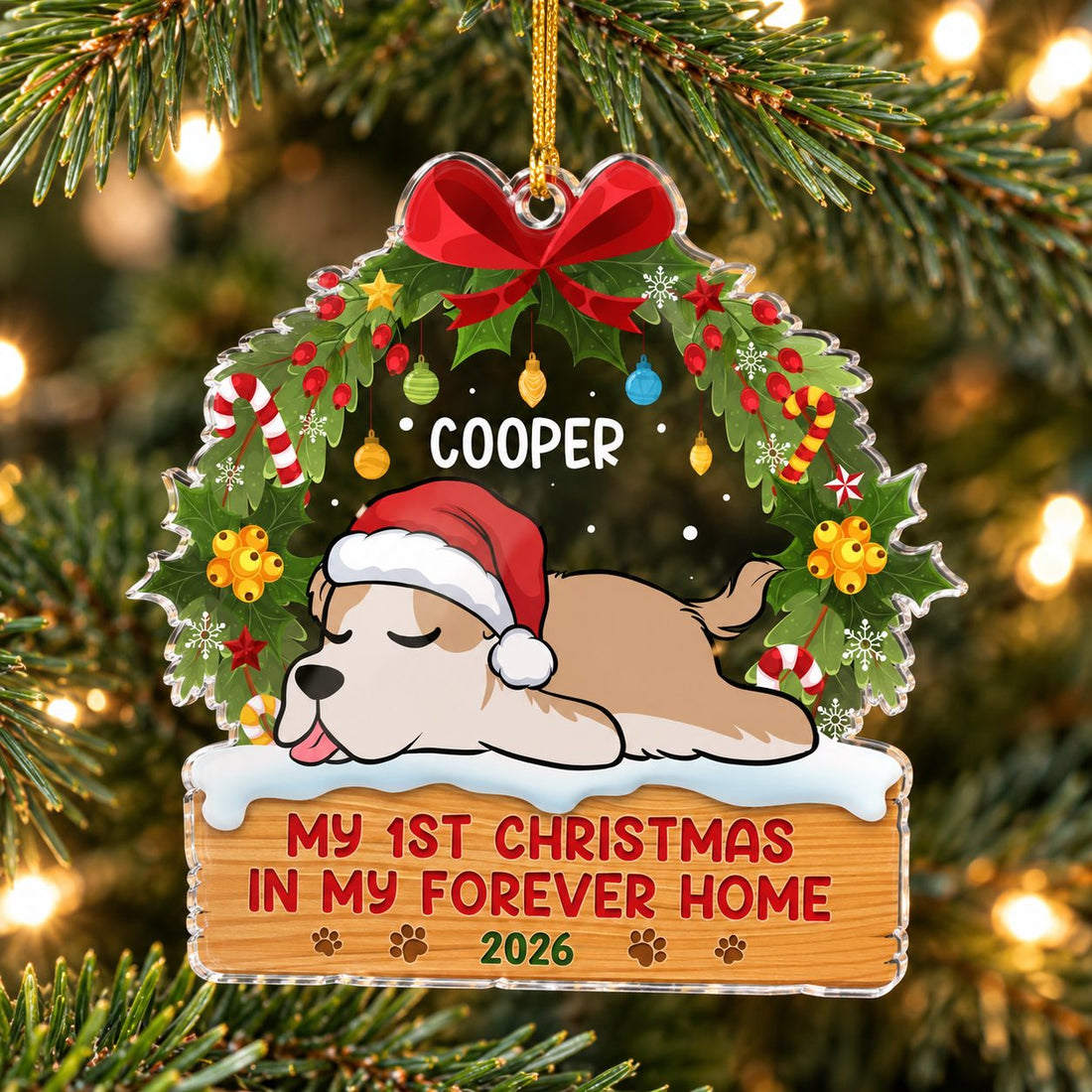 Personalized Cooper dog 1st Christmas acrylic ornament hanging on a Christmas tree branch