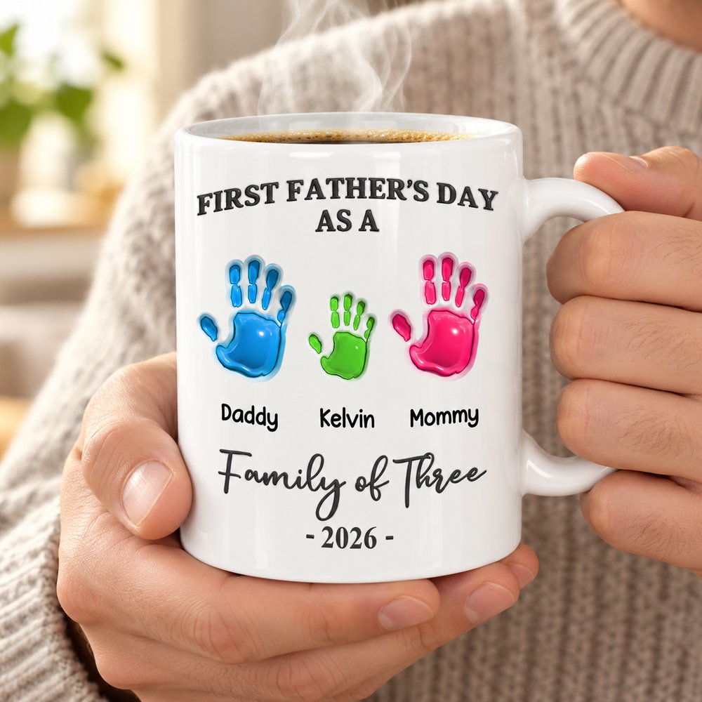 New dad holding personalized Family of Three handprints ceramic mug with steaming coffee
