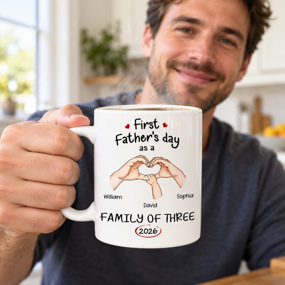 New dad holding personalized First Father's Day family of three ceramic mug with morning coffee