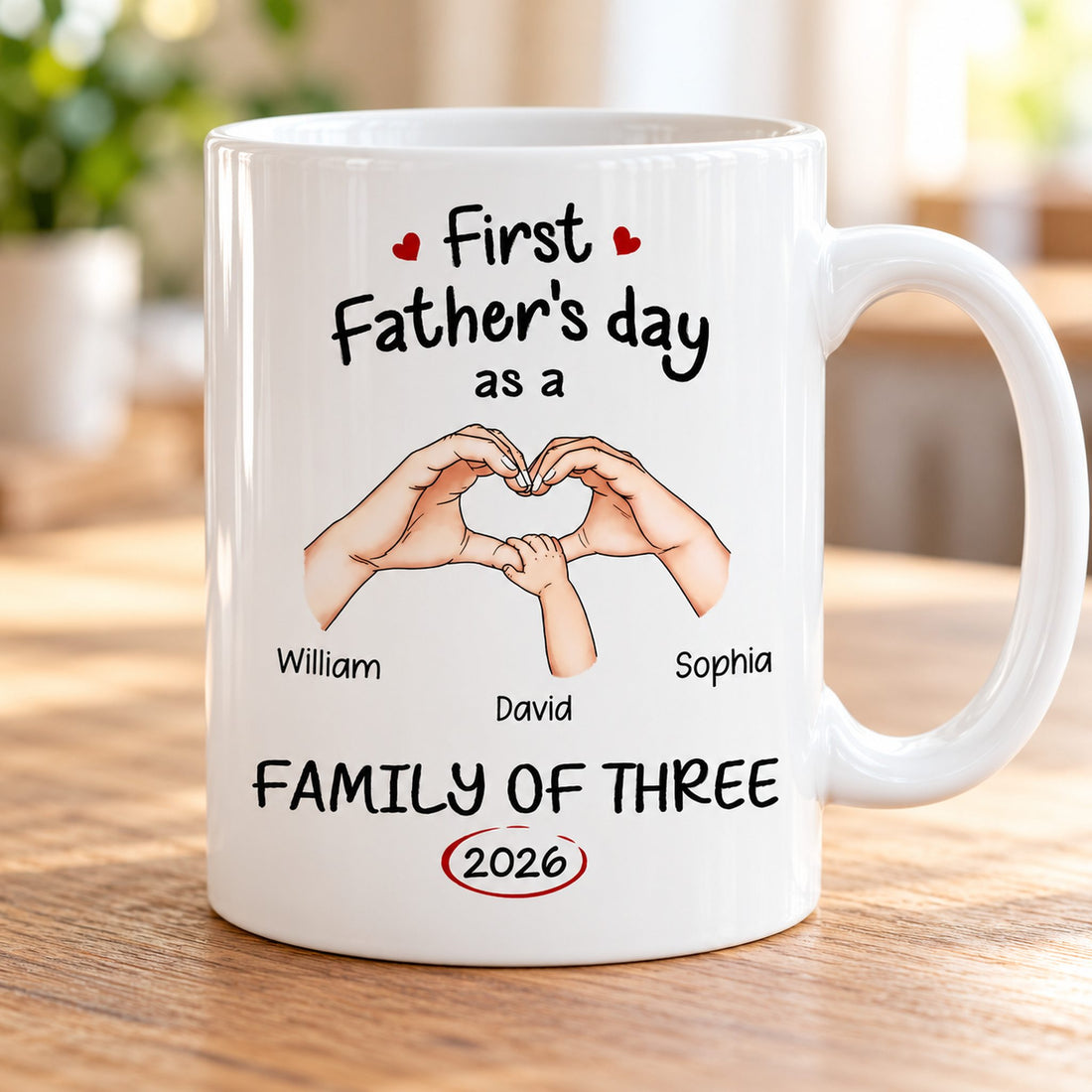 Close-up detail of personalized family hands illustration and custom names on glossy ceramic mug