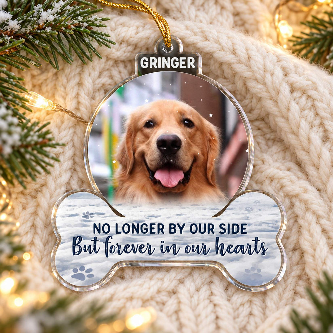 Custom photo dog memorial acrylic ornament GRINGER variant lying flat on cozy cream knit throw with pine sprigs