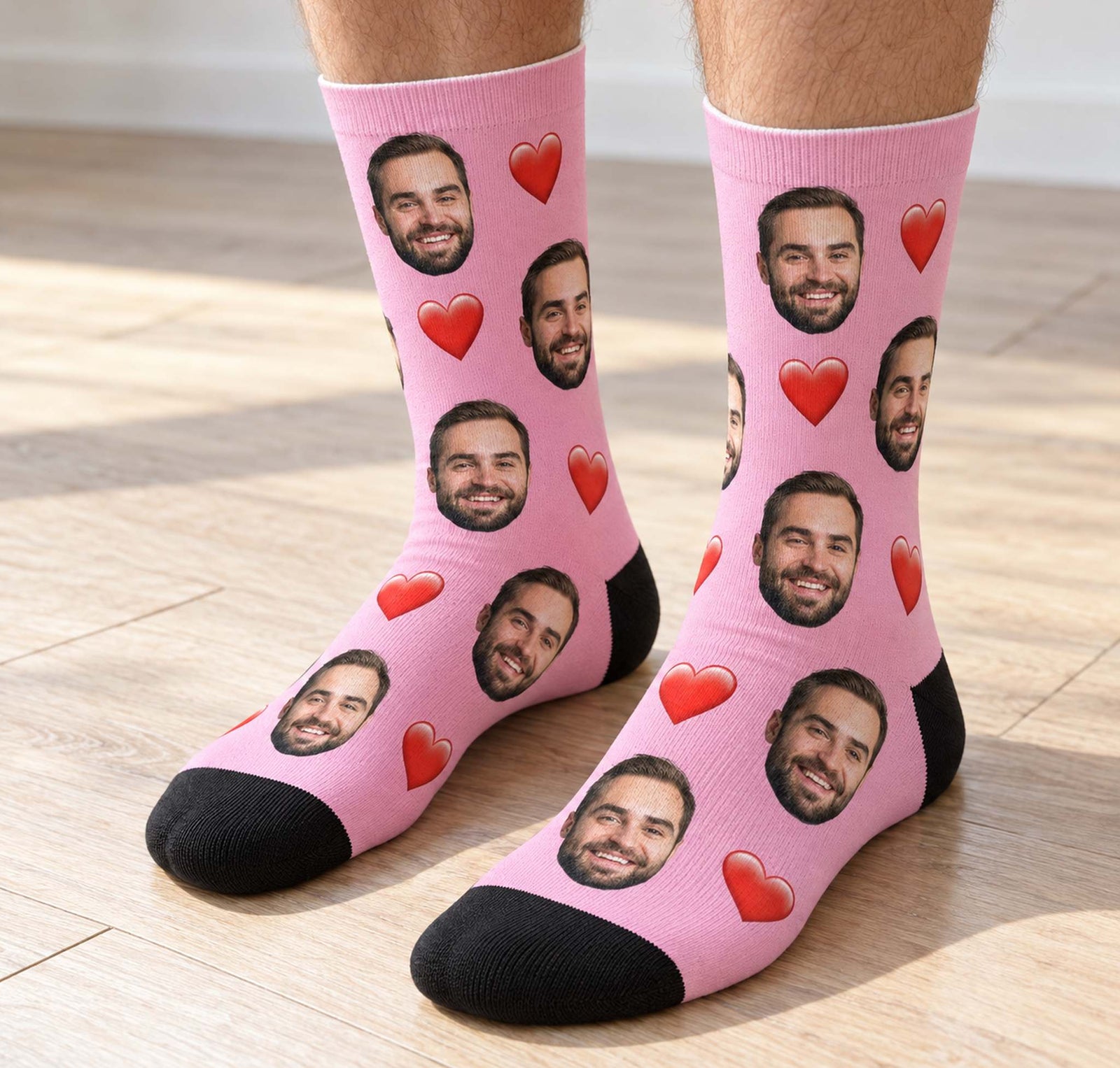 Adult wearing pink custom face photo crew socks with red hearts standing on wood floor