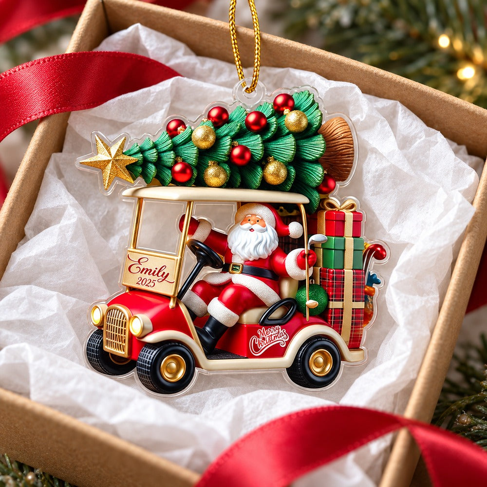 Santa golf cart Christmas ornament nestled in a small gift box with white tissue paper and red ribbon