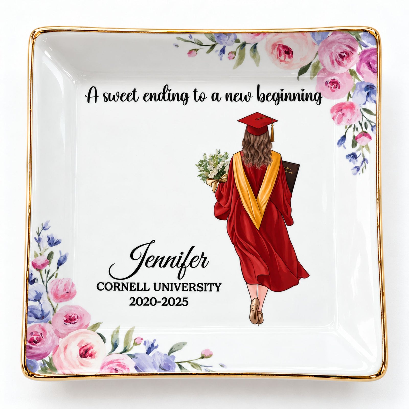 Close-up detail of gold rim and printed illustration on graduation jewelry dish