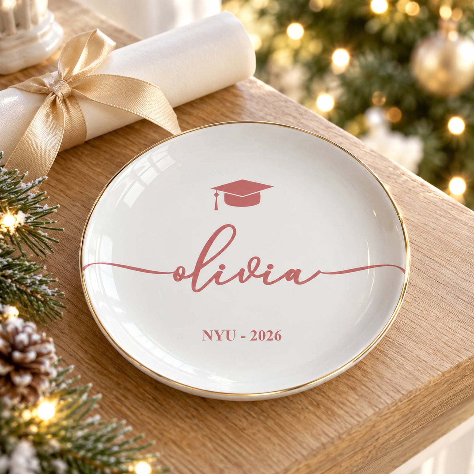 Custom graduation jewelry dish on mantel with diploma and soft holiday lights