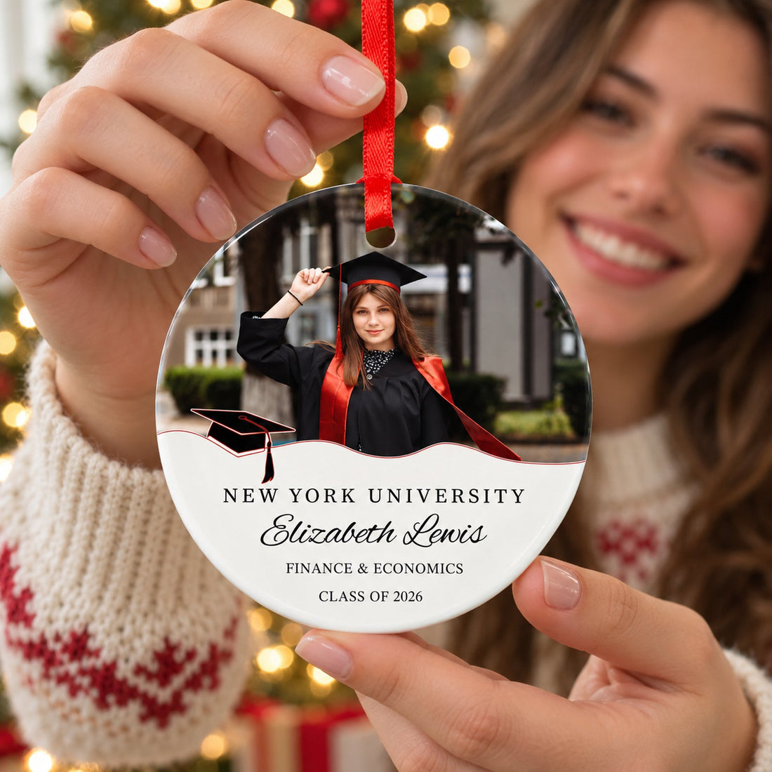 Happy graduate holding her personalized photo ceramic graduation ornament